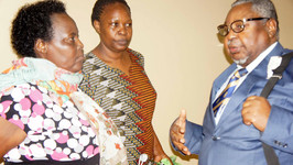 Margaret Nankinga (middle) listening to Cameroon's Prof. Sammy Chumbow, President of ACALAN's Assembly of Academicians at an orthography harmonisation workshop held in Kampala some time back. On the left is ACALAN's  Uganda focal person, Ms. Ruth Muguta from the Ministry of Gender, Labour and Social Development