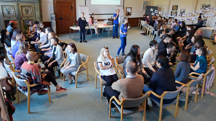 Participants in discussion in the Robison Gallery at Schloss Leopoldskron