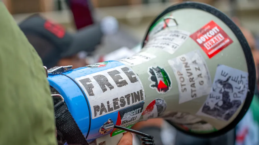Protester using megaphone at the National March for Palestine demonstration in London on July 6, 2024