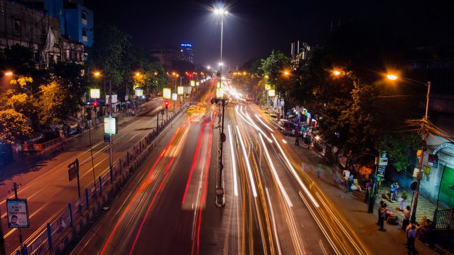 Cars on the road at night in Kolkata, India (Photo by Subhadeep Saha on Unsplash)