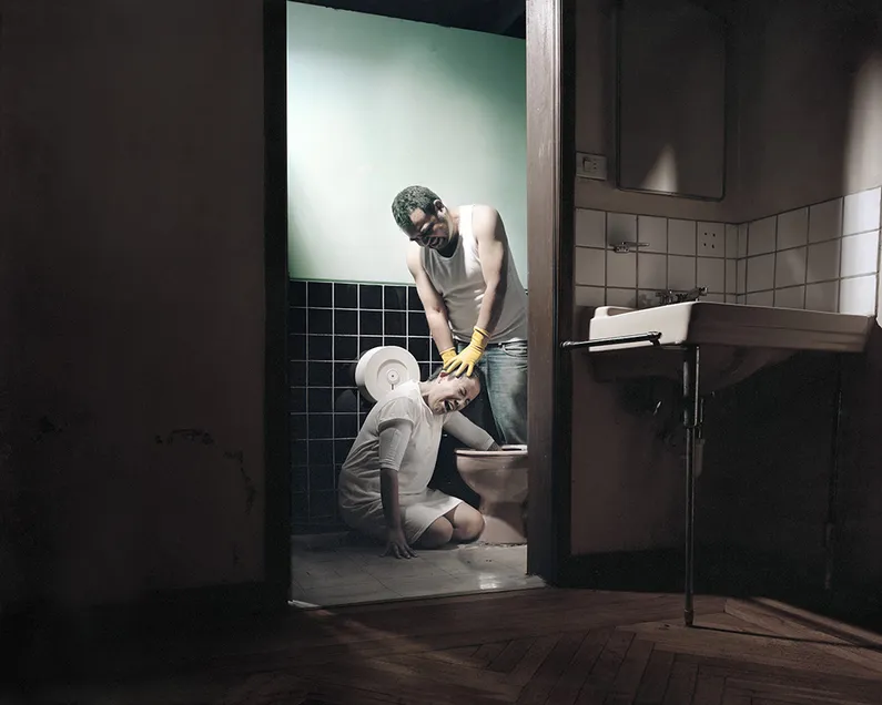 Man Committing Violence Against a Kneeling Woman