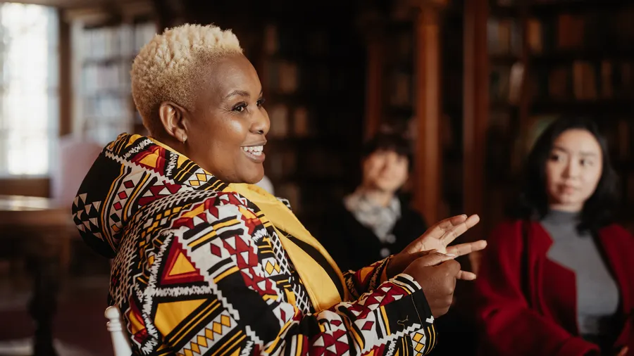 An image of Phinah Kodisang speaking to an audience during a session.