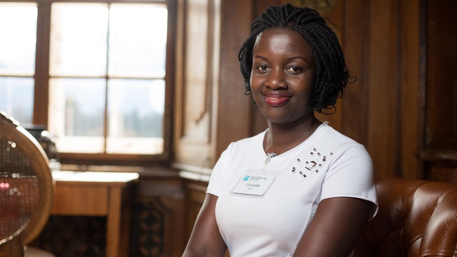 Charlotte Kalanzi, founder of the H.E.A.R.T stars club, sitting in Max Reinhardt’s former study at Schloss Leopoldskron