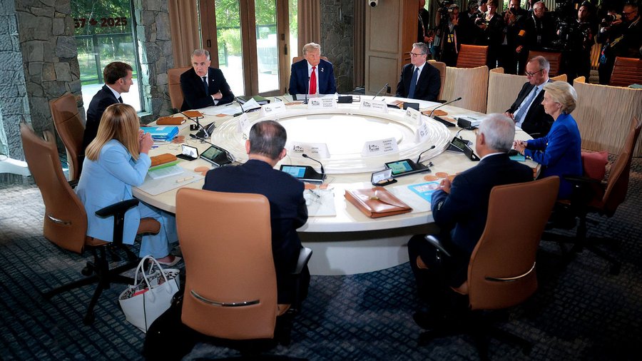 World leaders sit around a circular table during a discussion at the G7 Summit on June 16, 2025