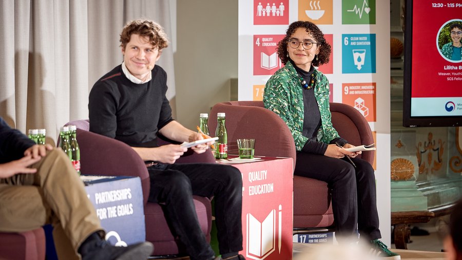 Lilitha Buti sits on stage during the International Forum on Education and Climate at Schloss Leopoldskron.