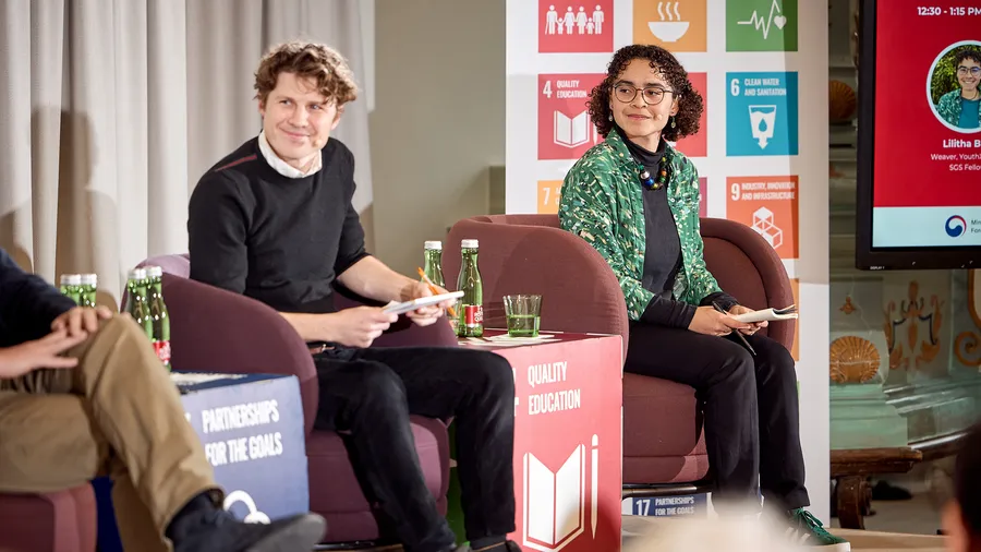 Lilitha Buti sits on stage during the International Forum on Education and Climate at Schloss Leopoldskron.