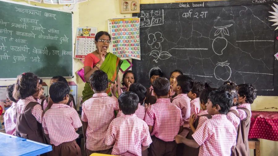 Children learning in a class in India