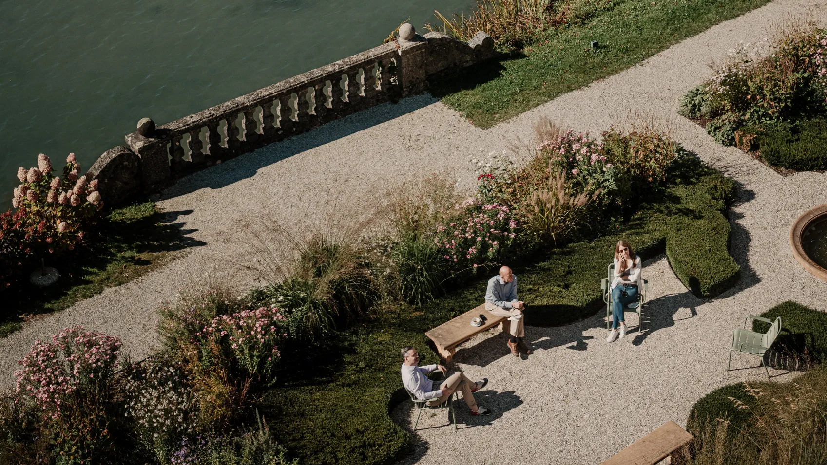 Airial Photo of the Schloss Garden With Three People Standing in the Middle
