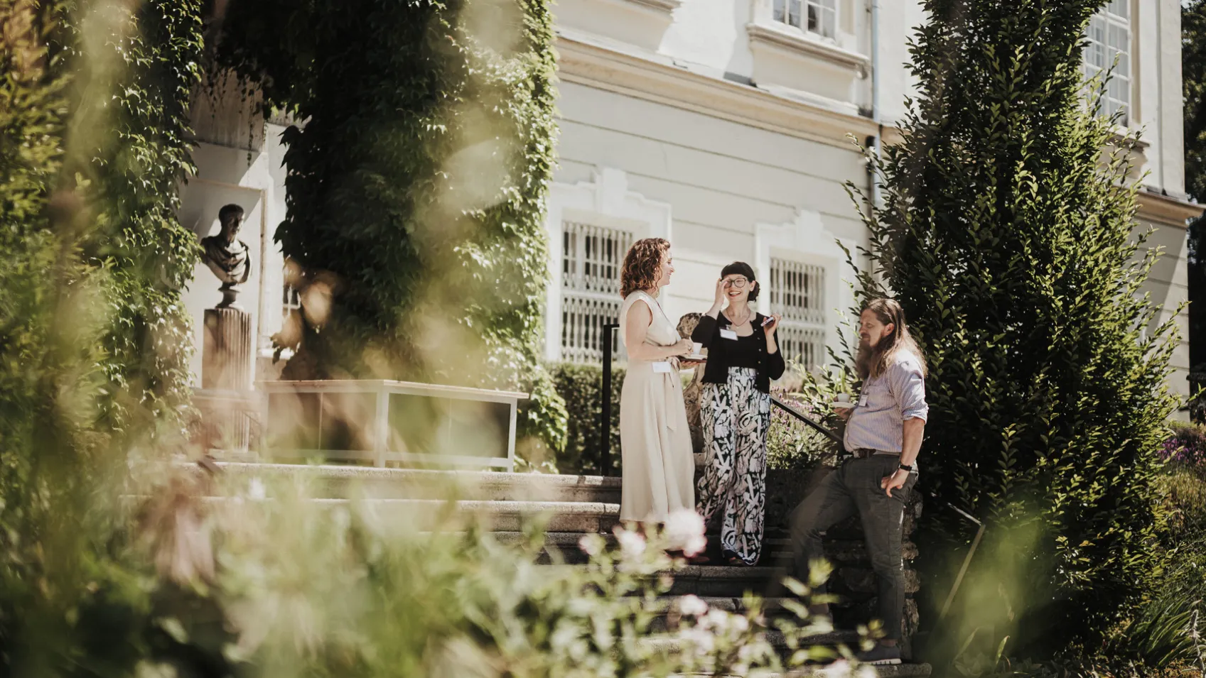 Three People Standing in the Schloss Garden