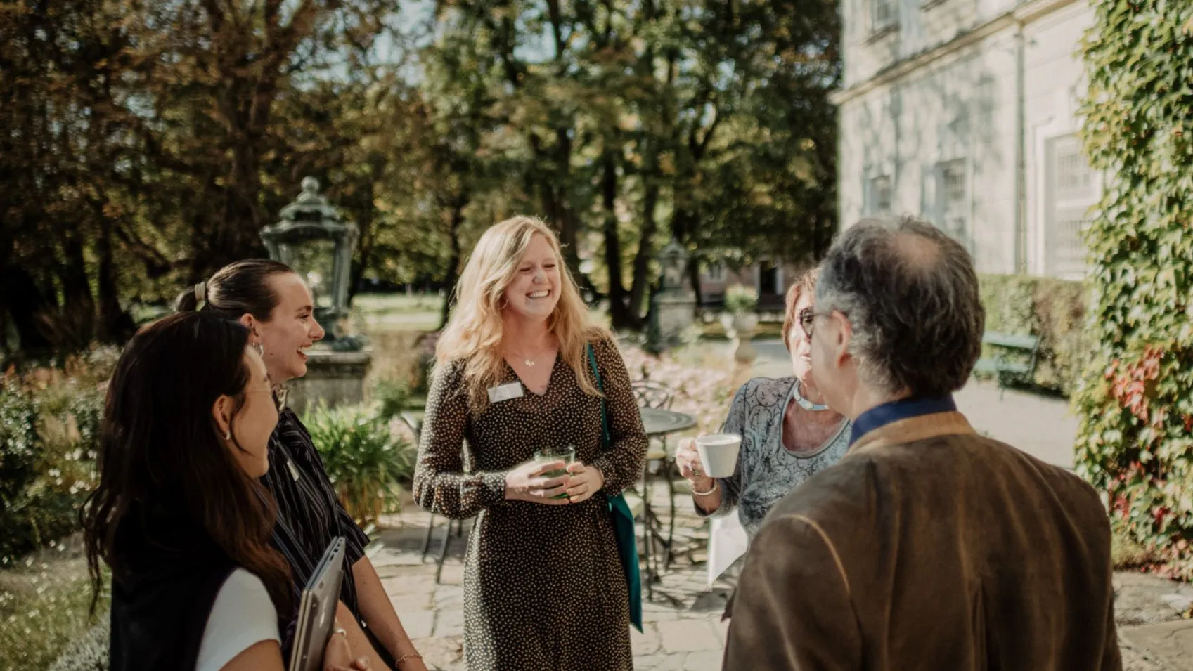 Group of People Outside the Schloss Talking