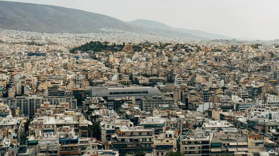 A view over the city of athens with many crowded biuldings