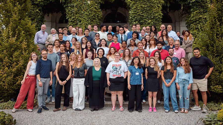 Group of Media Academy students and faculty standing on stairs in front of the Schloss Leopoldskron