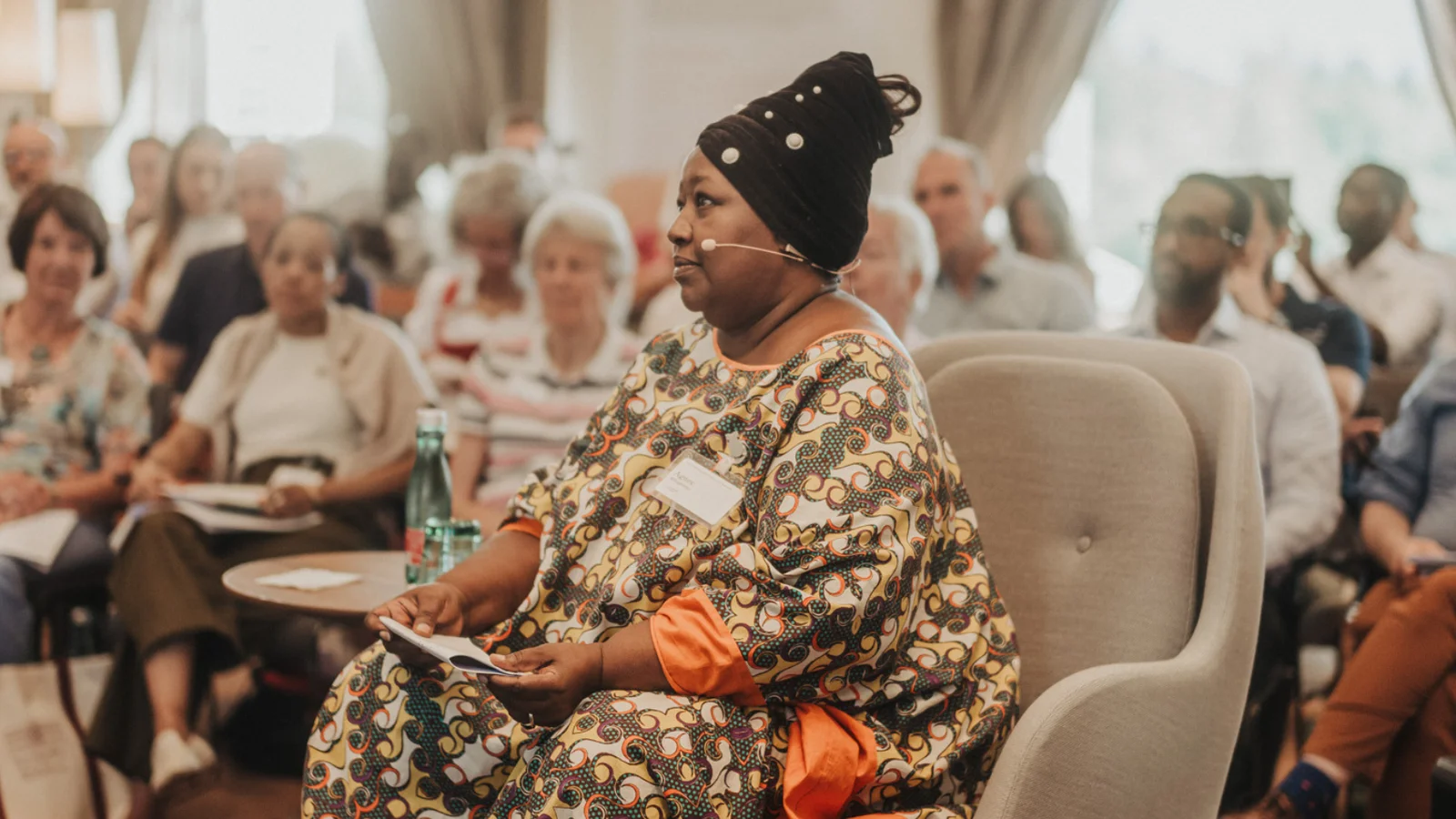 Prominent Fellow Agnes Binagwaho Sitting in a Chair at a Meeting Inside the Schloss Leopoldskron