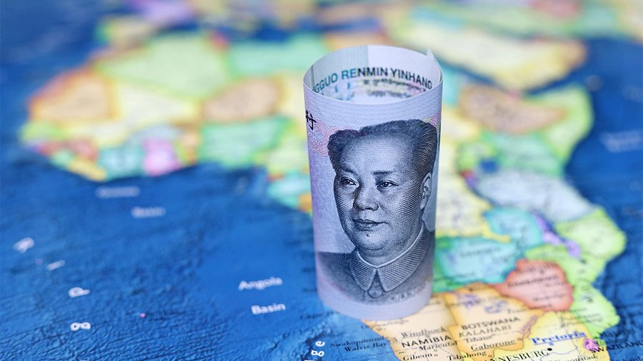 One Chinese Yuan currency bill on top of a blurry map of Africa