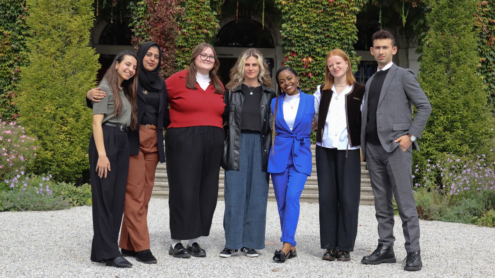 Group of Seven SG Interns Posing Outside