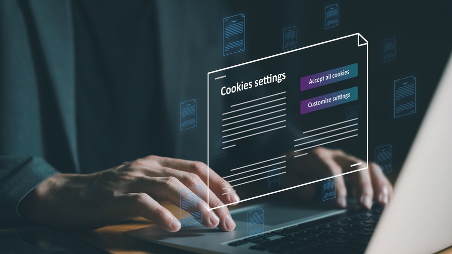 hand using laptop while choosing to accept internet cookies policy or reject