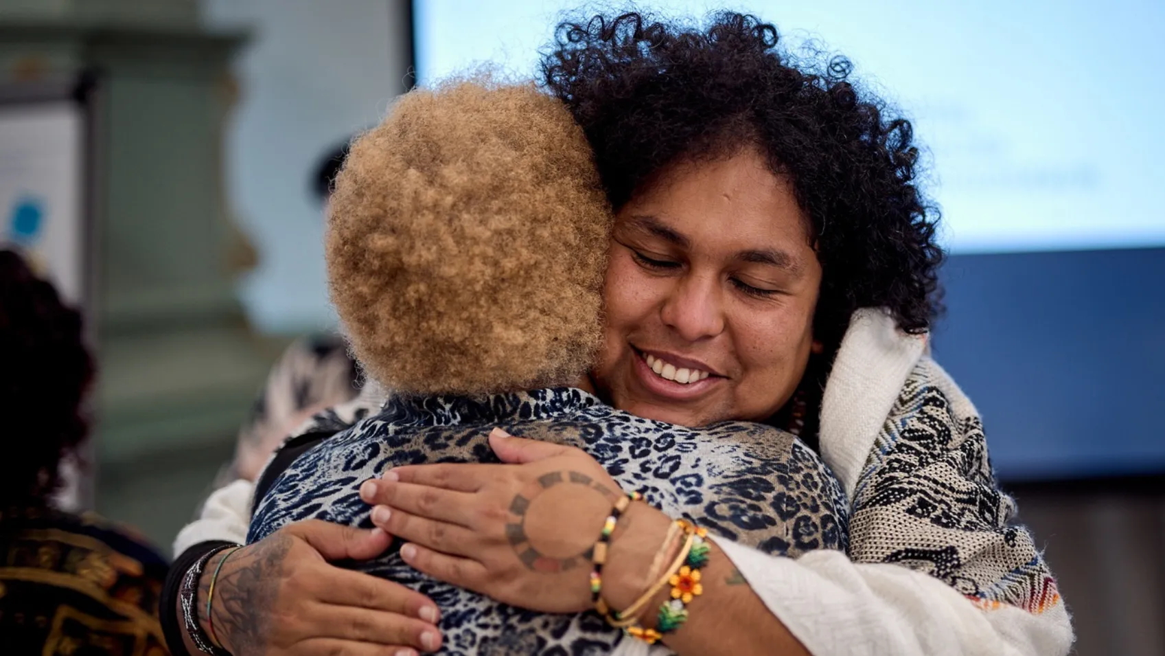 Two People Hugging Each Other