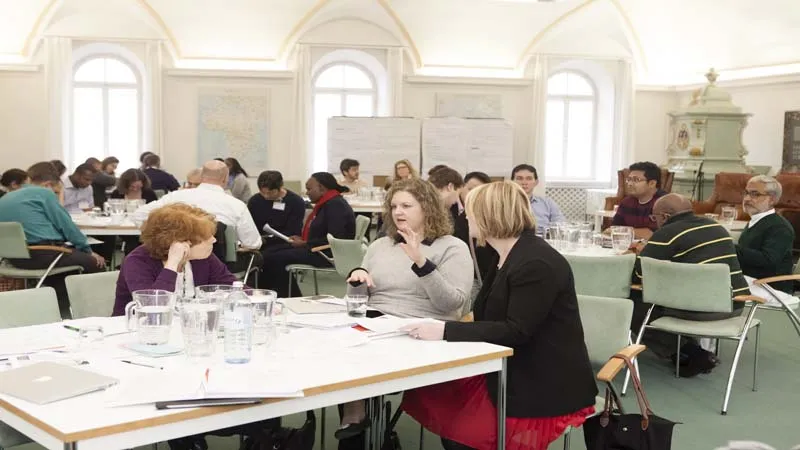 Fellows discussing ideas during the Session "Untapped Talent: Can better testing and data accelerate creativity in learning and societies?"
