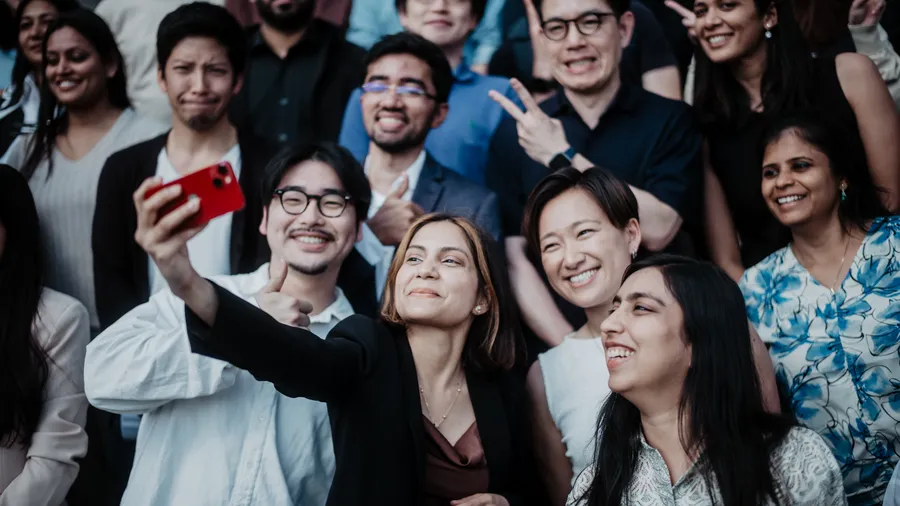 Group of people pose for a selfie.