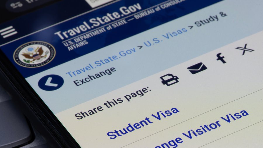 The U.S. Department of State's student and exchange visas page is seen on its official website on the screen of a smartphone.