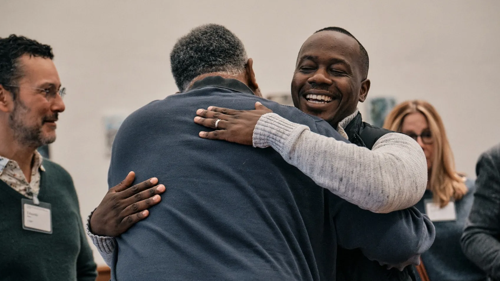 Two People Hugging at Global Innovations on Youth Violence Safety and Justice Program