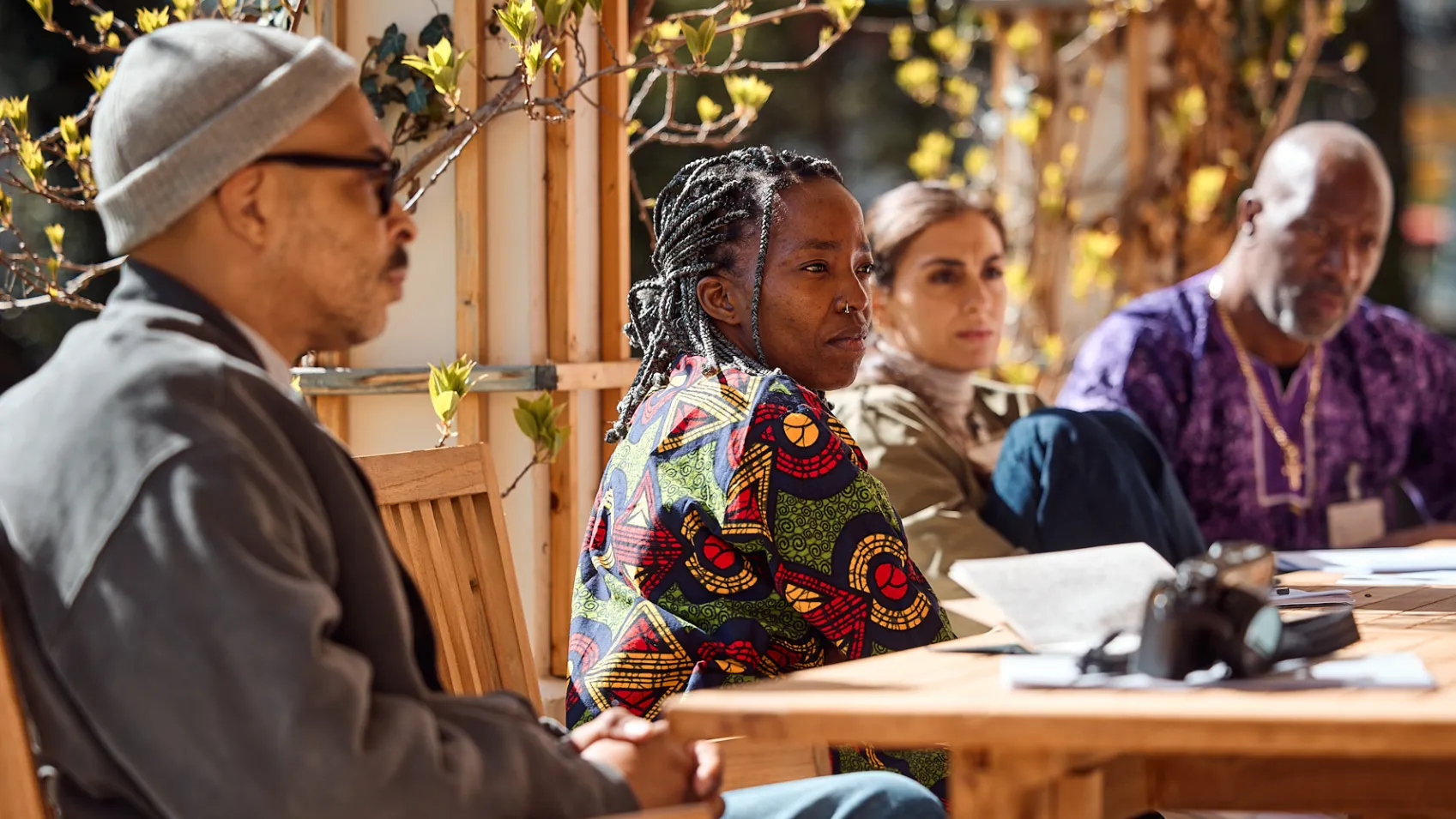 A Group of Three People Talking