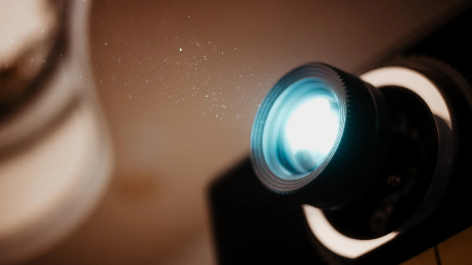 A Closeup Image of a Lightray and Lense of a Beamer