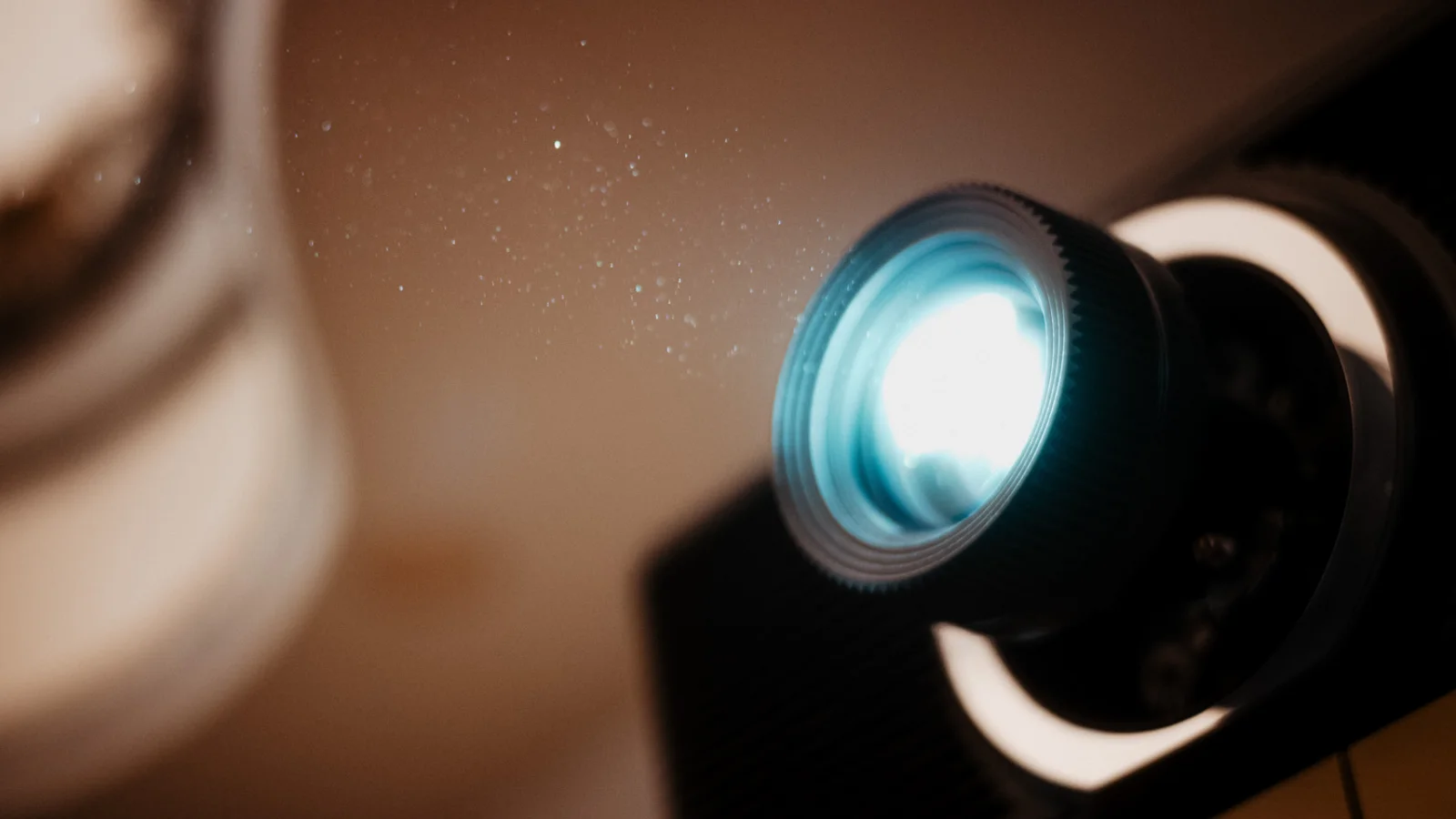 A Closeup Image of a Lightray and Lense of a Beamer