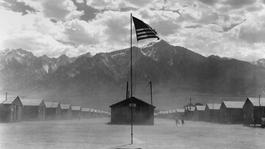 Dust storm at Manzanar internment camp for Japanese Americans for during World War 2. California, July 3, 1942. Photo by Dorothea Lange.