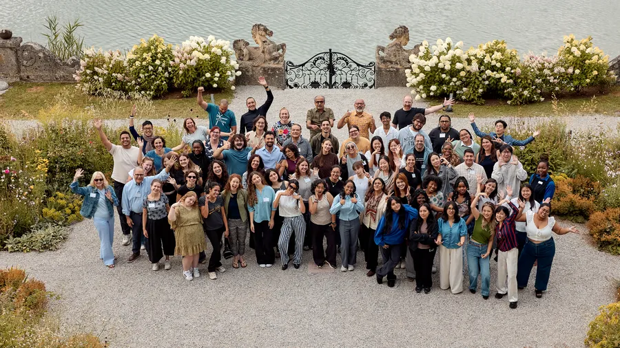 a group of people look happy outside schloss lepooldskron