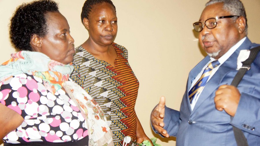 Margaret Nankinga (middle) listening to Cameroon's Prof. Sammy Chumbow, President of ACALAN's Assembly of Academicians at an orthography harmonisation workshop held in Kampala some time back. On the left is ACALAN's  Uganda focal person, Ms. Ruth Muguta from the Ministry of Gender, Labour and Social Development 