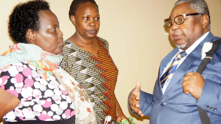 Margaret Nankinga (middle) listening to Cameroon's Prof. Sammy Chumbow, President of ACALAN's Assembly of Academicians at an orthography harmonisation workshop held in Kampala some time back. On the left is ACALAN's  Uganda focal person, Ms. Ruth Muguta from the Ministry of Gender, Labour and Social Development 