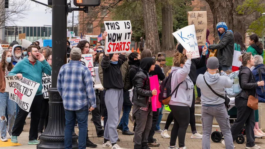 A photo of a group protesting on the street.
