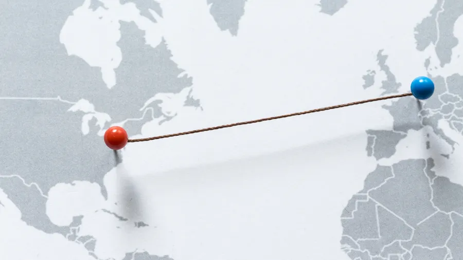  A map of the world with two points connecting the U.S. and Europe