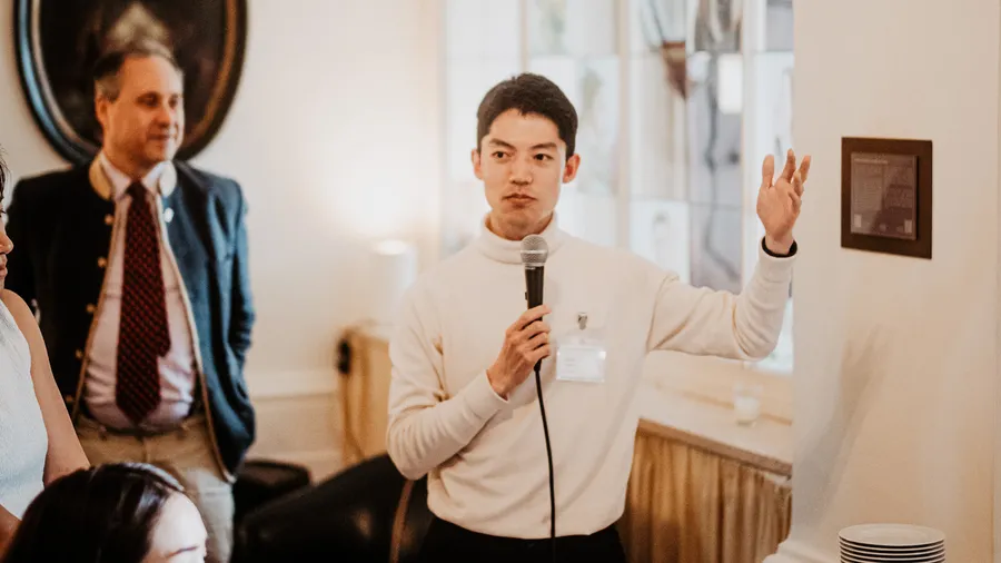 Takeshi Hidaka, a Salzburg Global Fellow, speaks into a microphone at the Japan-India Transformative Technology Network.