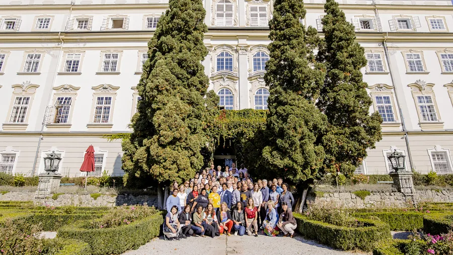 Participants pose for a group photo outside Schloss Leopoldskron at Salzburg Global Seminar