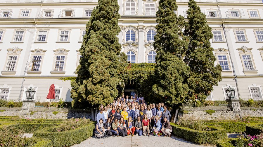 Participants pose for a group photo outside Schloss Leopoldskron at Salzburg Global Seminar