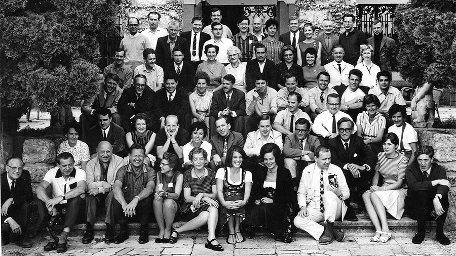a group of individuals standing on the stairs of Schloss Leopoldskron