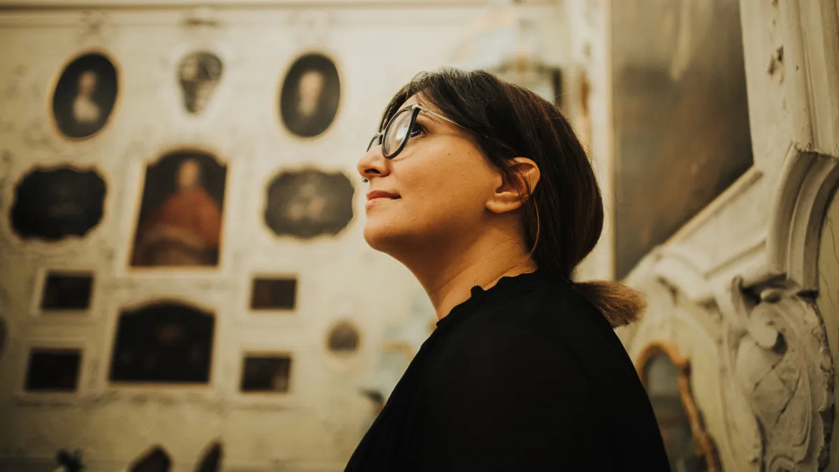 Woman Admiring the Interior of the Schloss