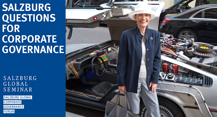 Isabella D. Bunn next to a DeLorean outside the theater showing Back to the Future